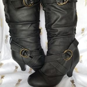 Black strappy, heeled boots